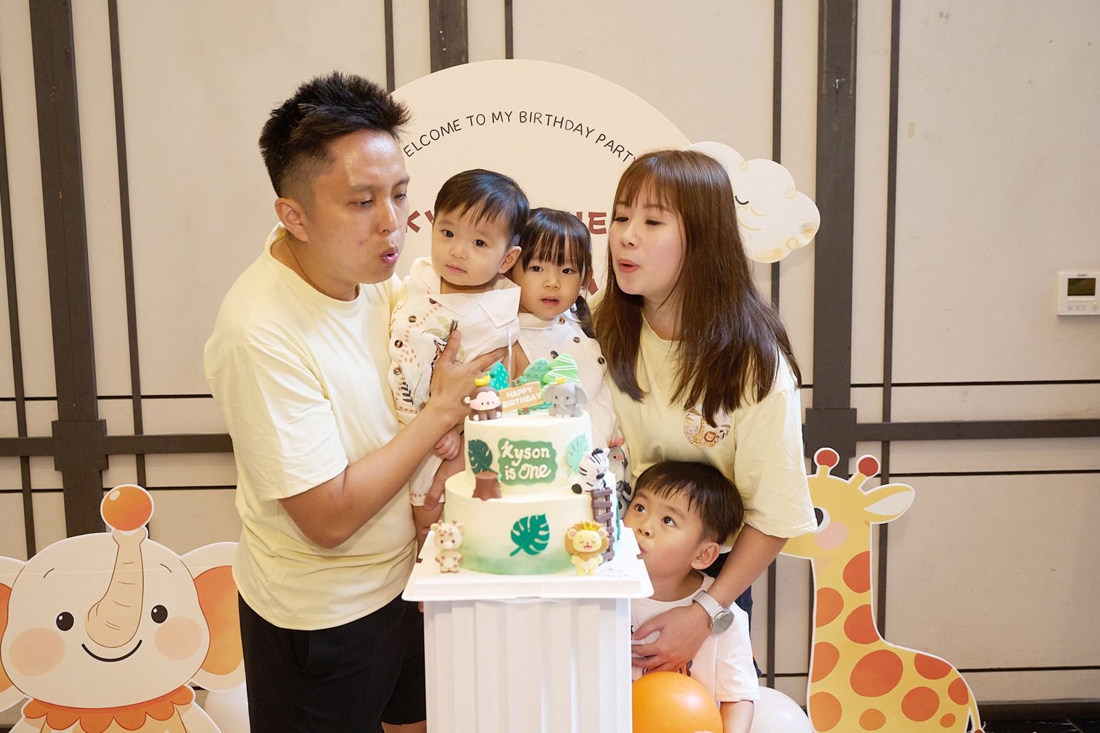 Blowing out the candles · Family Blowing out the candles
