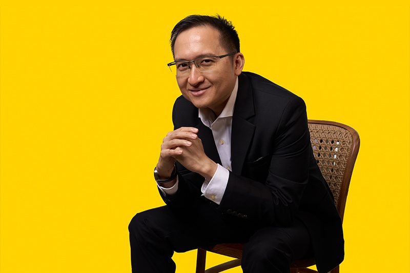 Yellow backdrop, cane chair · Profile Portraits Yellow backdrop, cane chair